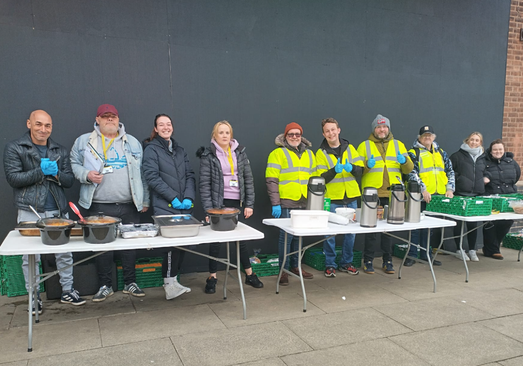 People in Hull serving food for Raise the Roof