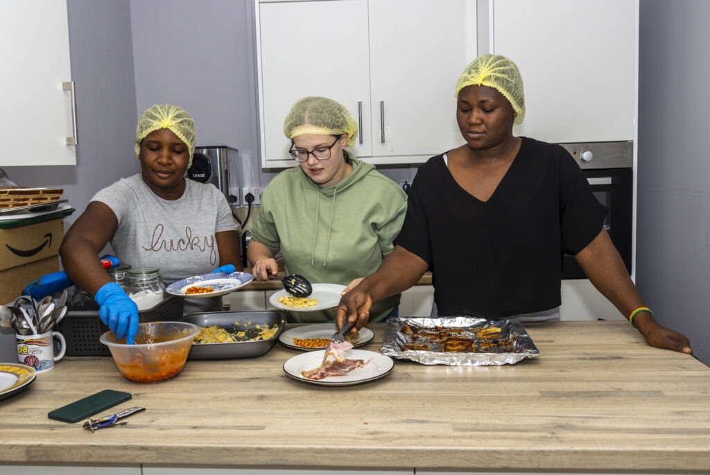 women serving food